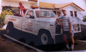 Original unaltered family photograph beside vintage tow truck