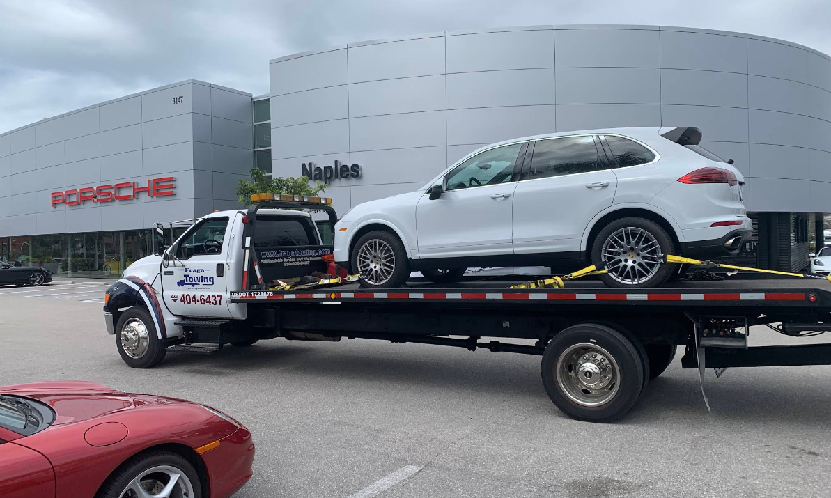 Fraga Towing transporting Porsche Cayenne